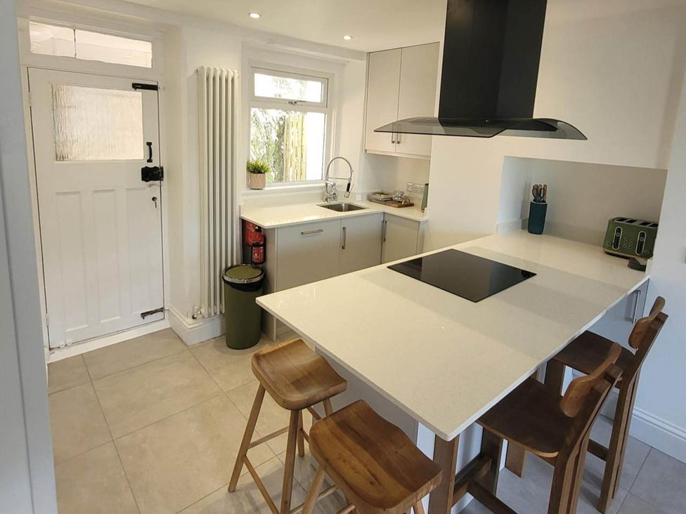 A kitchen with counter and appliances at Looe Cottage Seaside views log fire sleeps 4 in Looe