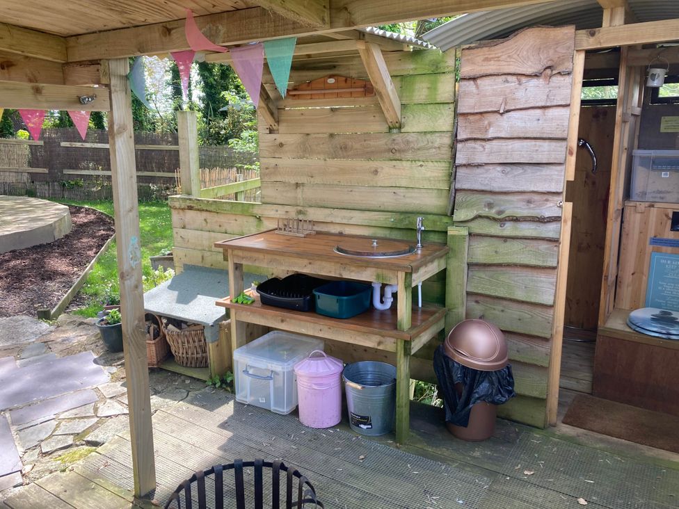 An outdoor kitchen area with a sink and counter at The Owl House in countryside setting near Niwbwrch (newborough)
