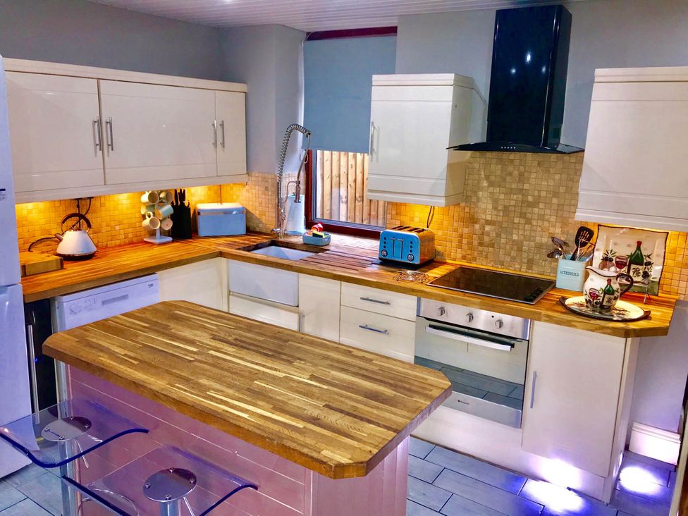 A kitchen with cabinets and appliances at Tanygrisiau near Blaenau Ffestiniog