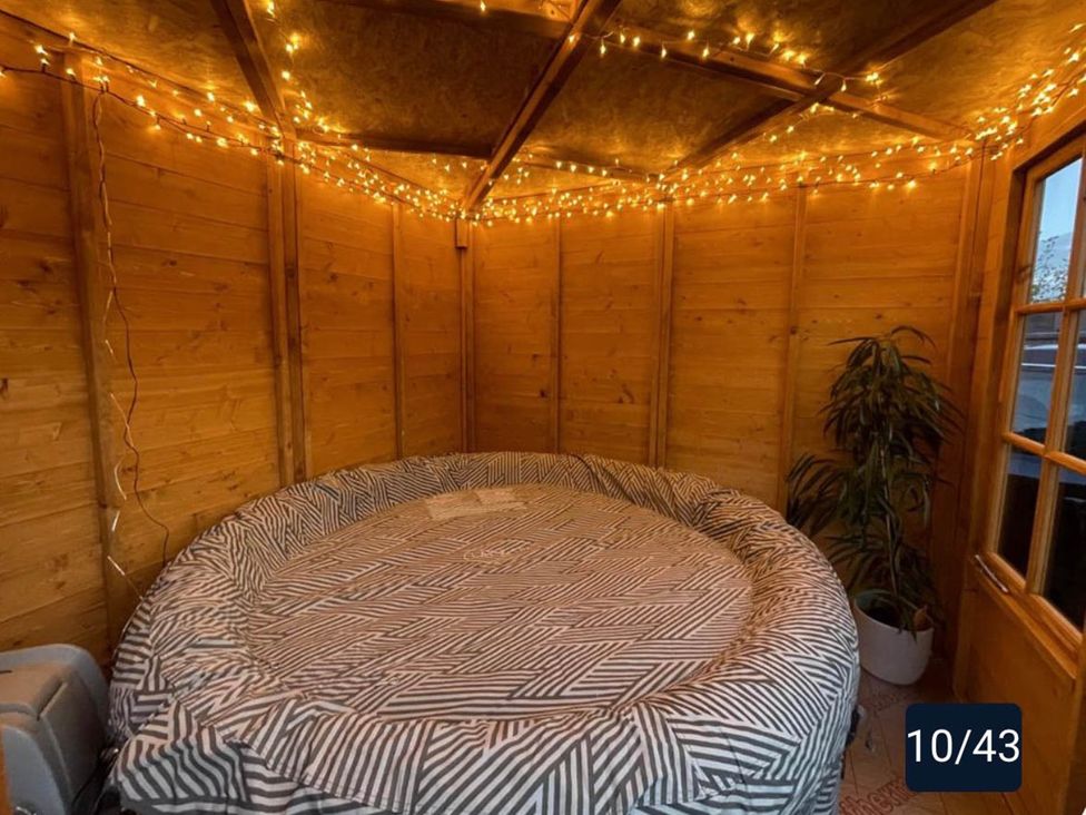 A circular bed with fairy lights in a snug at Tanygrisiau near Blaenau Ffestiniog