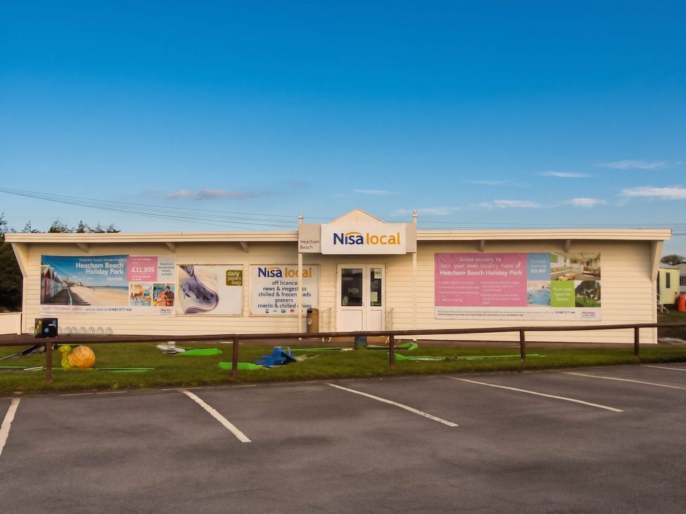 A store facade with advertisements at Heacham Beach Holiday Park in Norfolk
