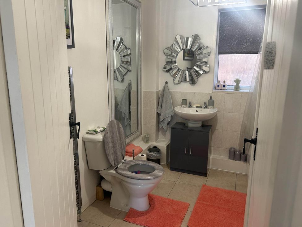 A bathroom featuring a toilet and sink at Immaculate 3Bed House in Bridgnorth