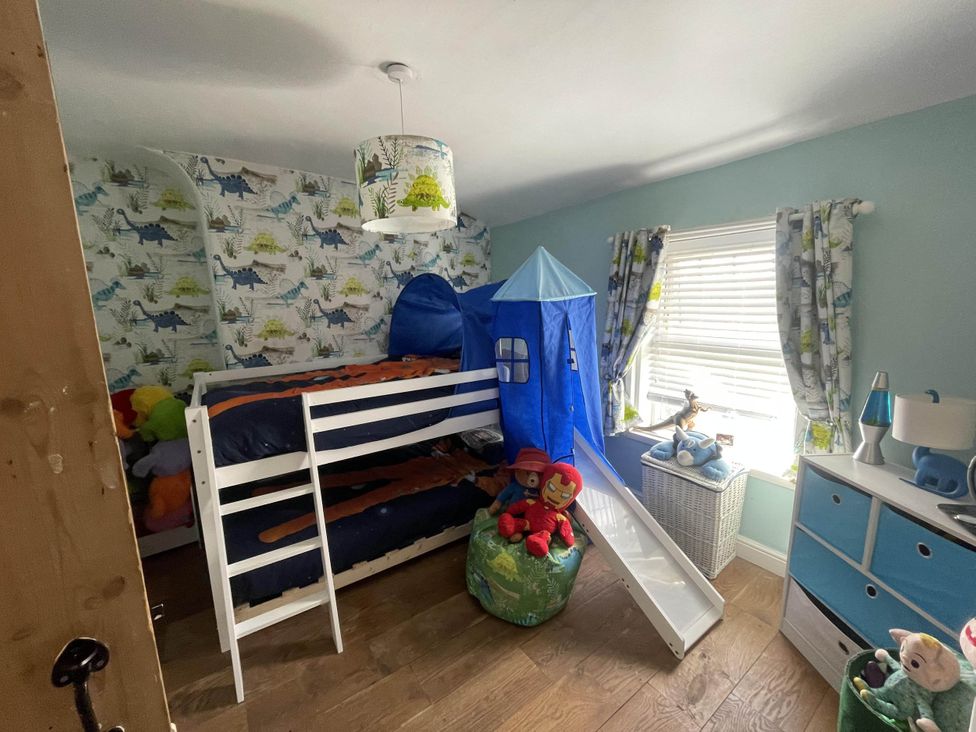 A bedroom with a bunk bed and slide at Immaculate 3Bed House in Bridgnorth