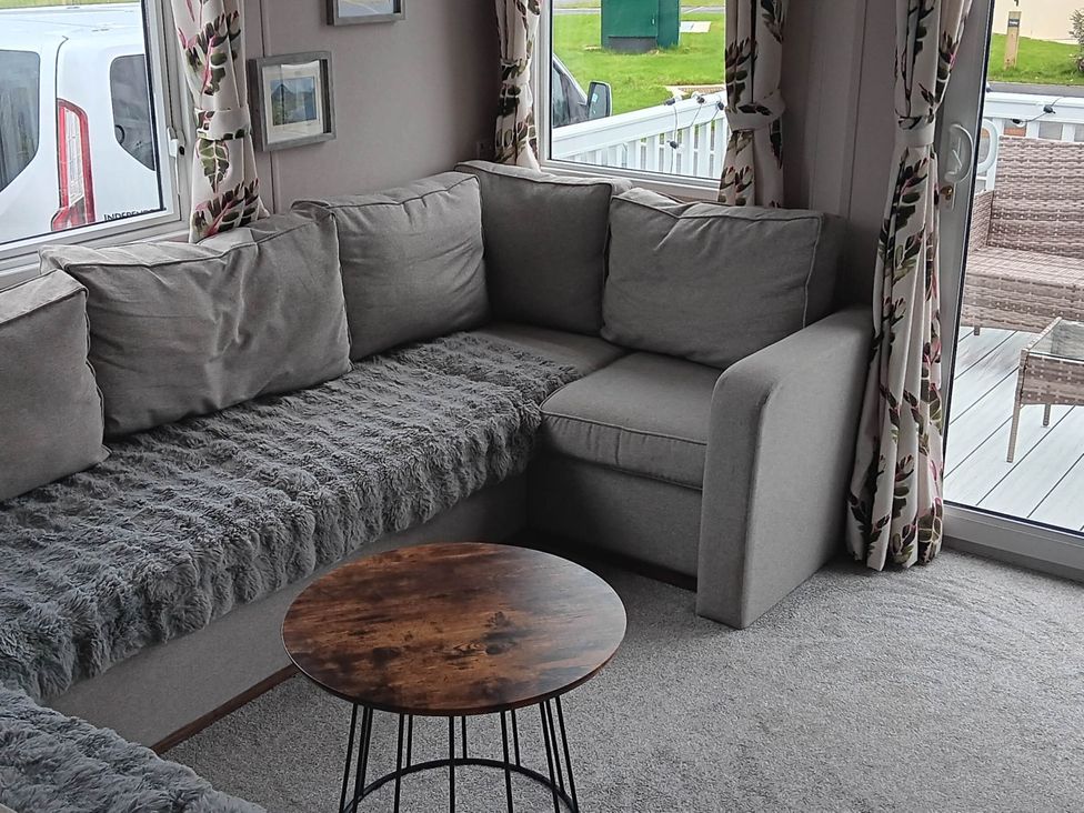 A living room with a sofa and coffee table at 