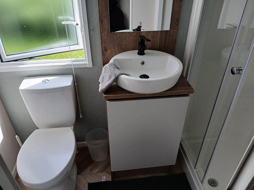 A bathroom with a sink and toilet at 