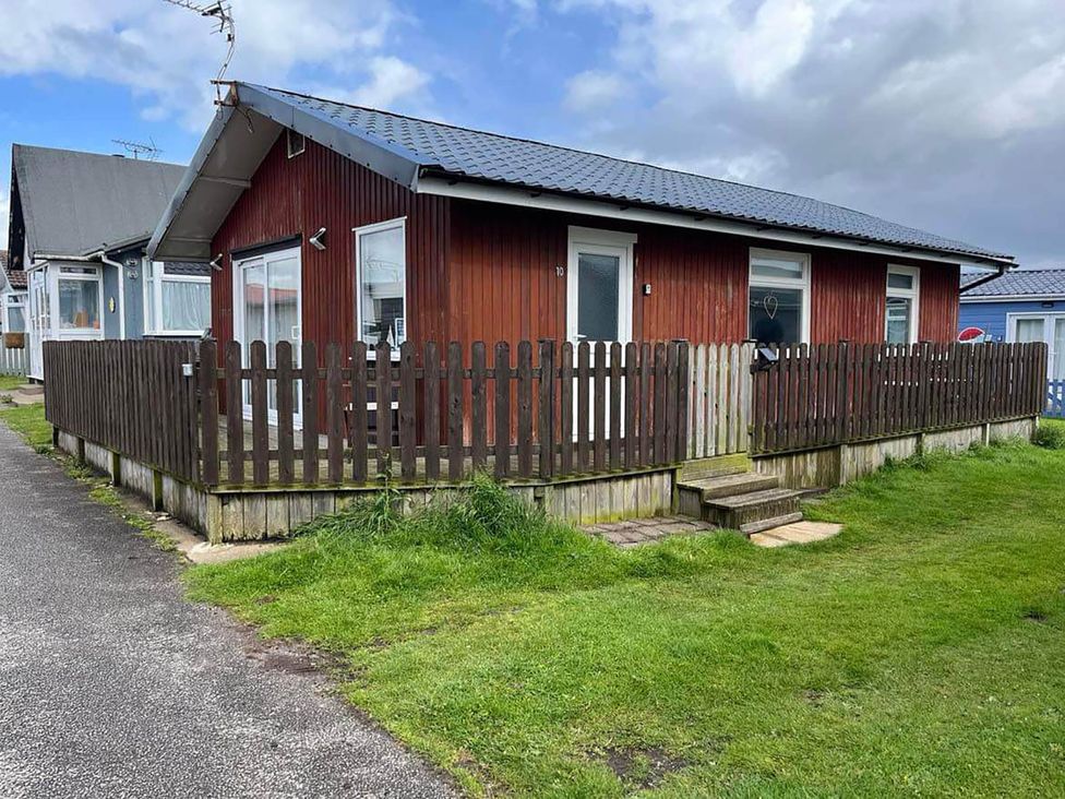 A house with a wooden fence and pathway at a property in Bridlington
