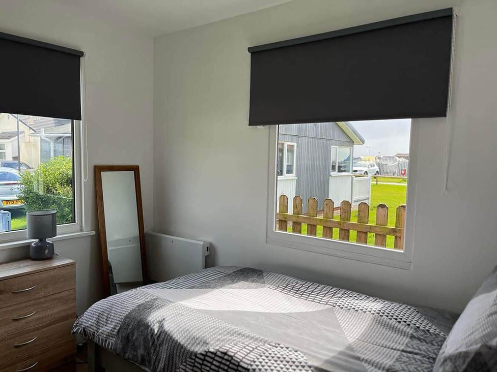 A bedroom with a bed and a window at the property in Bridlington