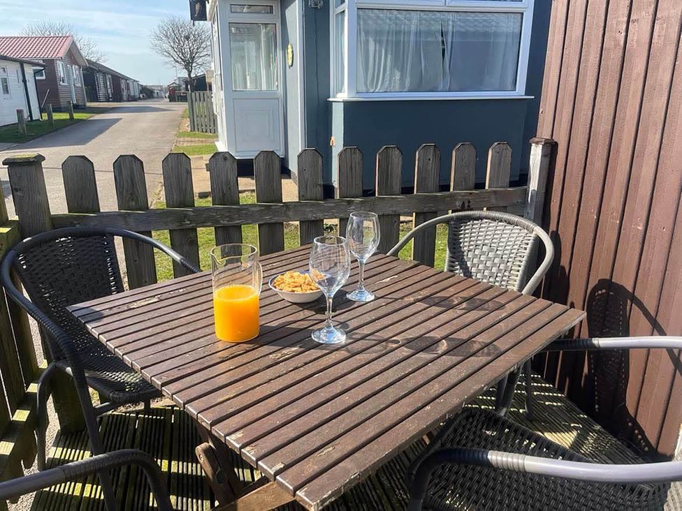 A table with drinks and snacks in an outdoor seating area at the property in Bridlington
