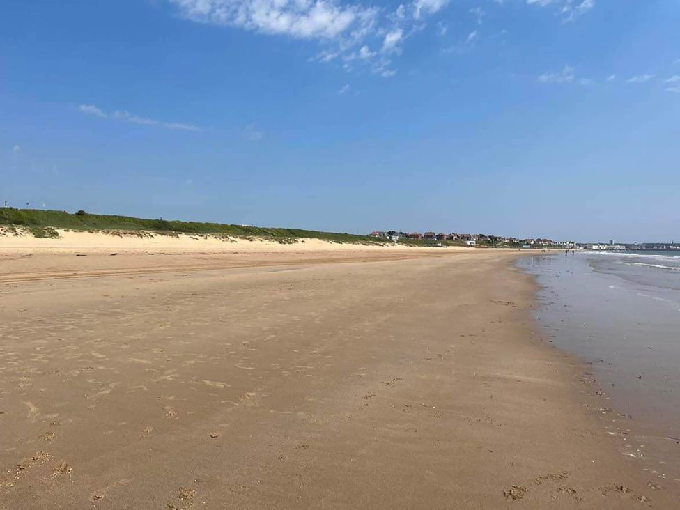 A beach with sand and water at the coast in Bridlington