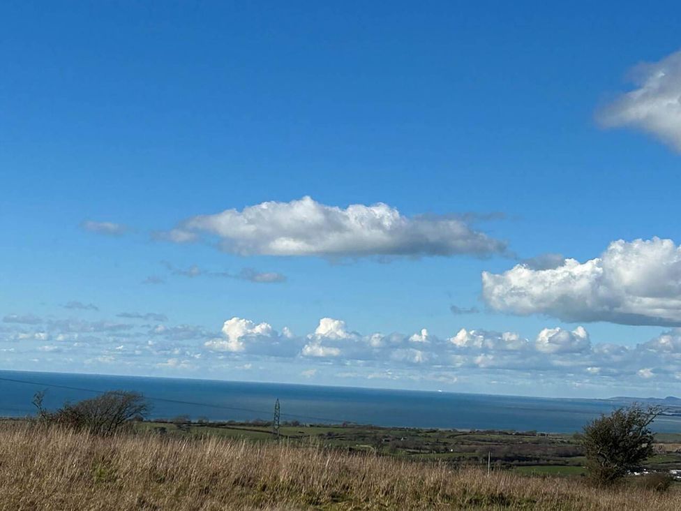 A view of the sea and clouds in the landscape near Nebo near Penygroes