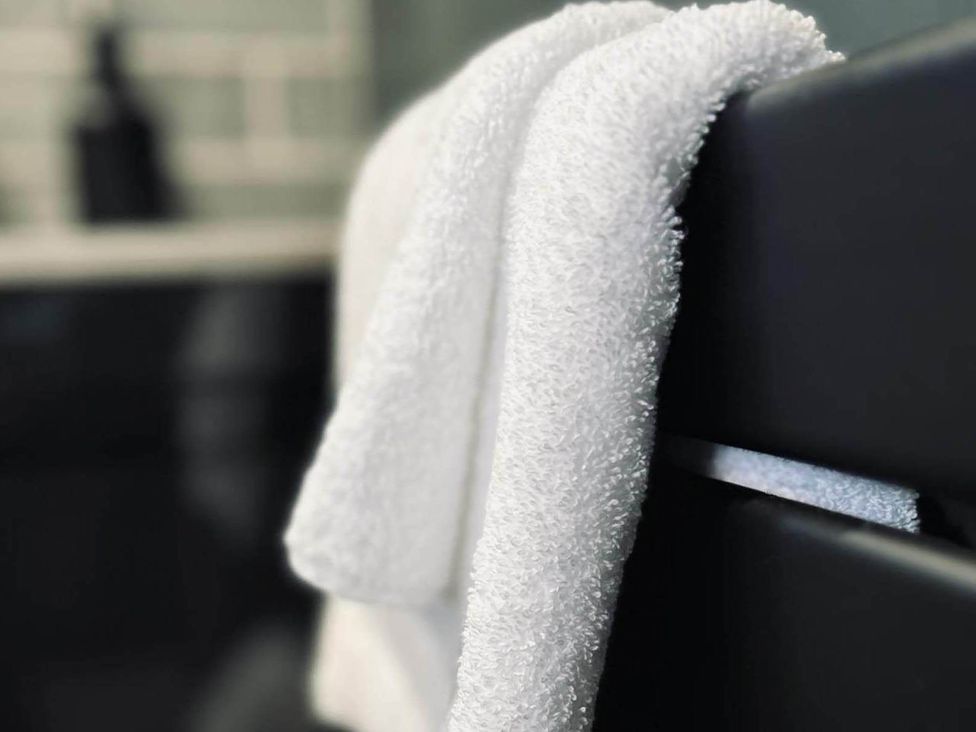 Two towels hanging in a bathroom at 