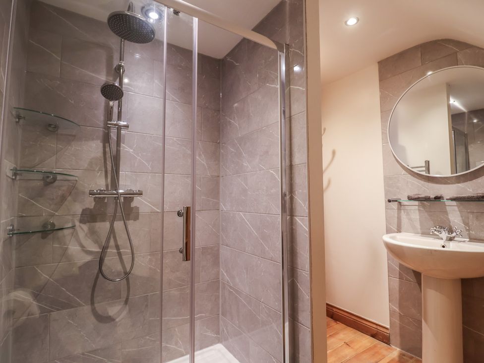 A bathroom with a shower and sink at The Linhay in Cotleigh Nr. Honiton