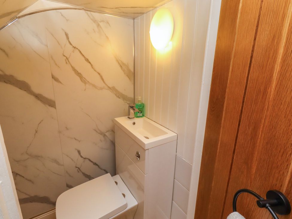 A bathroom with a sink and toilet at Farnecrest in Seahouses