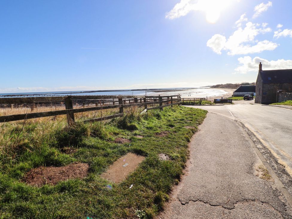 An outdoor scene with ocean and road at Spinnaker