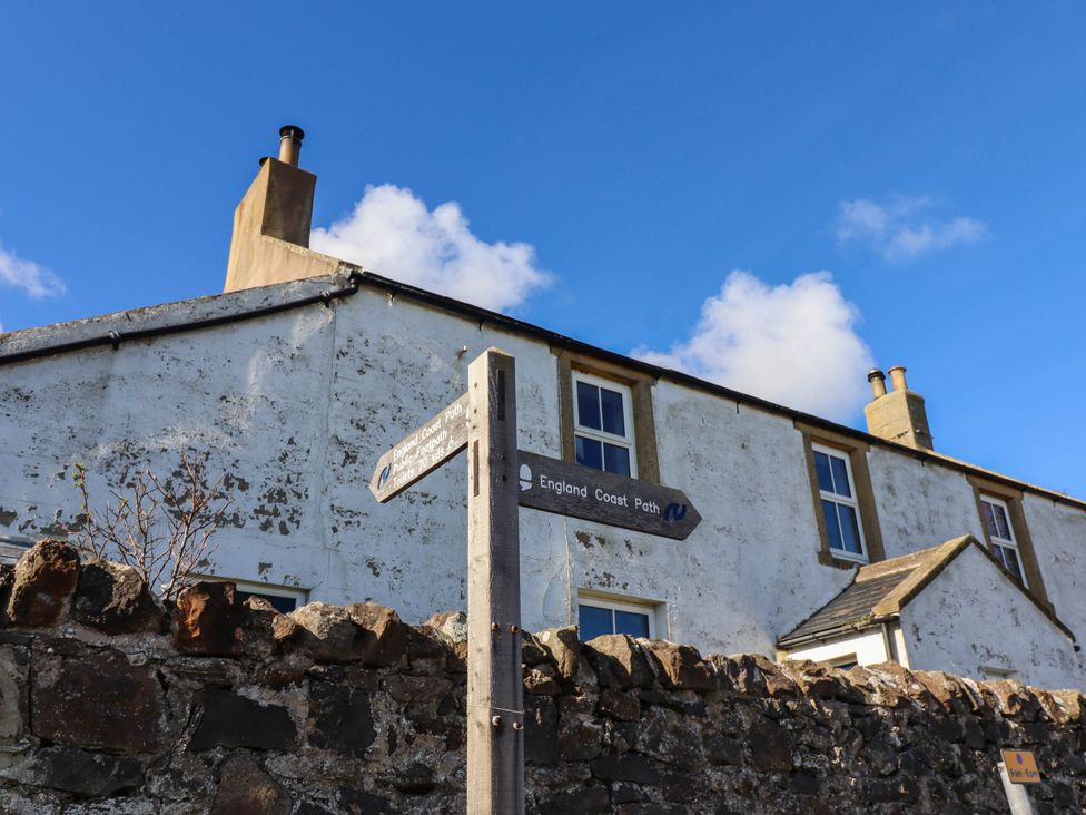 A building and signpost at Spinnaker