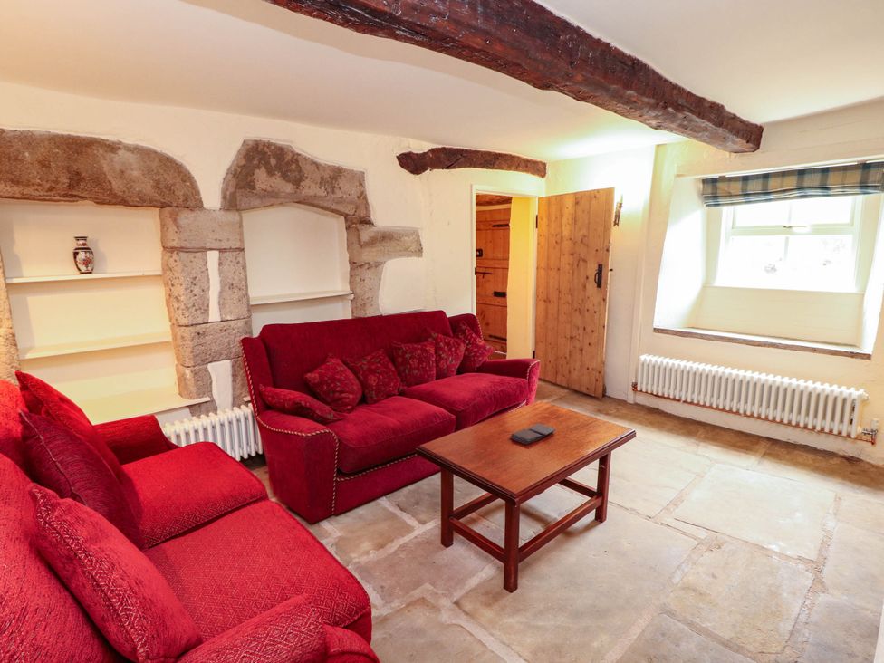 A living room with a sofa and coffee table at Claybottom Farm near Hesket Newmarket