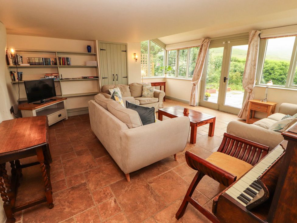 A living room with a sofa and coffee table at Claybottom Farm near Hesket Newmarket