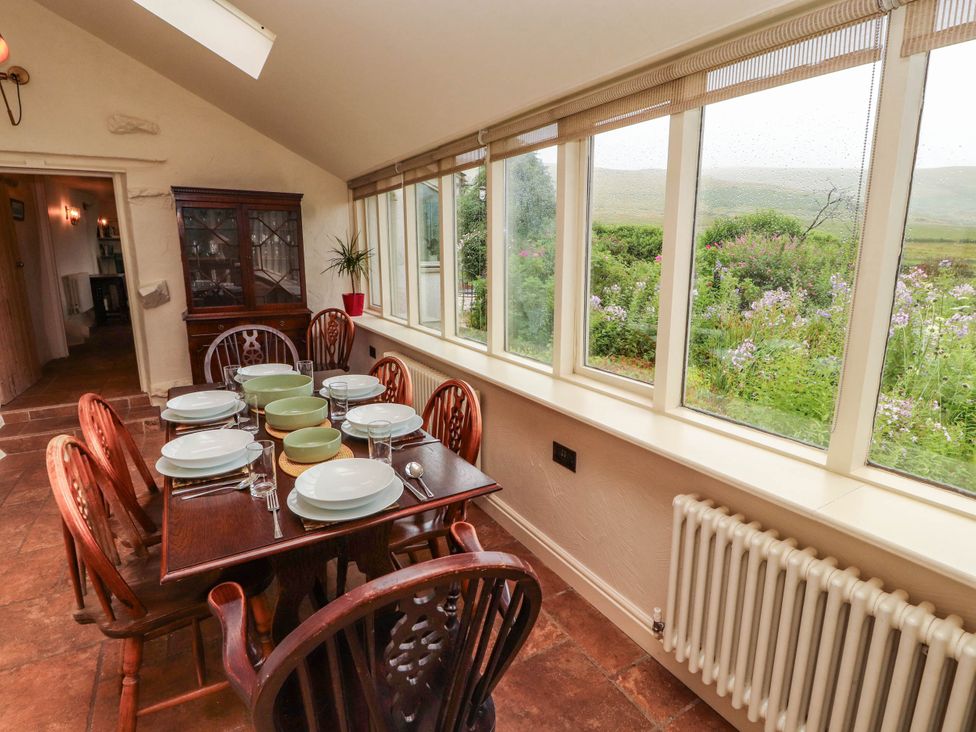 A dining room with a table set for meals at Claybottom Farm near Hesket Newmarket