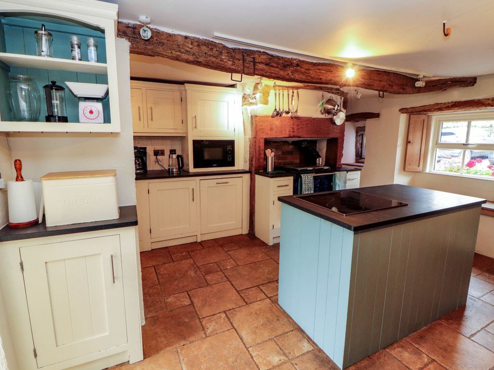 A kitchen with cabinets and appliances at Claybottom Farm near Hesket Newmarket