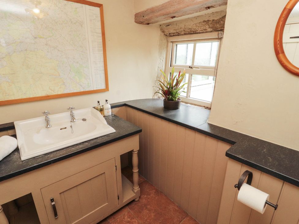 A bathroom with a washbasin and a window at Claybottom Farm near Hesket Newmarket