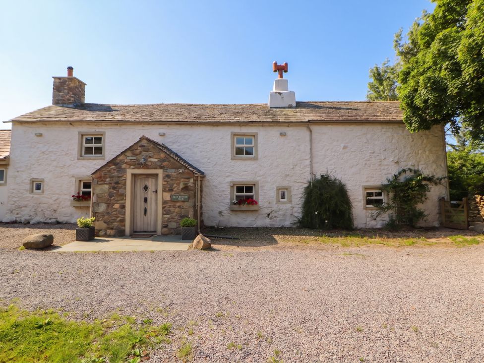 A cottage exterior with stone details at Claybottom Farm Hesket Newmarket