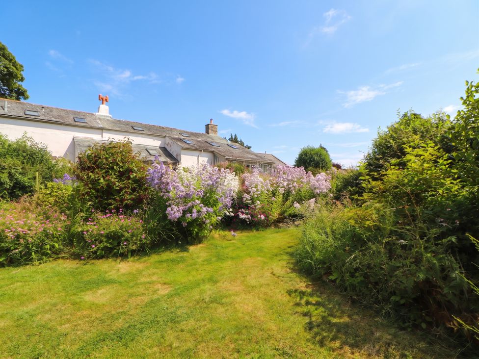 A garden with flowers and grass at Claybottom Farm in Hesket Newmarket