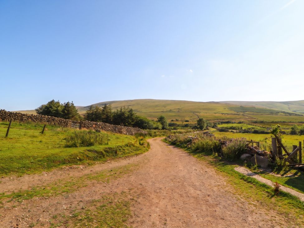 A dirt road in a rural landscape at Claybottom Farm in Hesket Newmarket