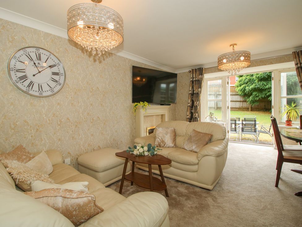 A living room with a sofa and coffee table at 18 Hengrave Meadow Telford