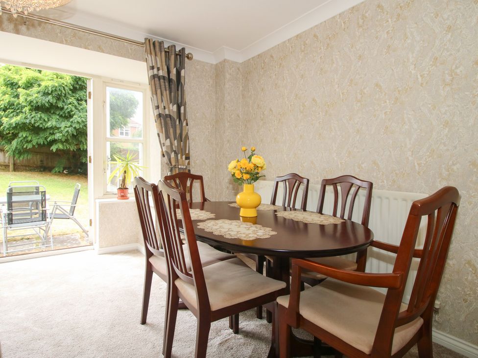 A dining room with a table and chairs at 18 Hengrave Meadow Telford