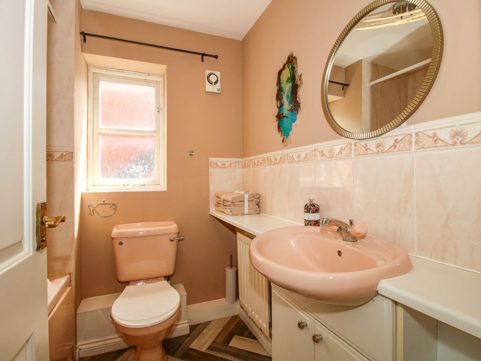 A bathroom with a toilet and sink at 18 Hengrave Meadow Telford