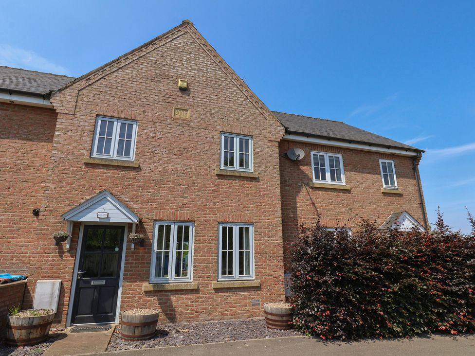 A brick house with windows and a front door at The Cosy Haven in Malton