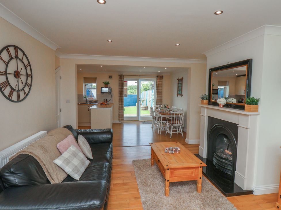 A living room with a sofa and coffee table at The Cosy Haven in Malton