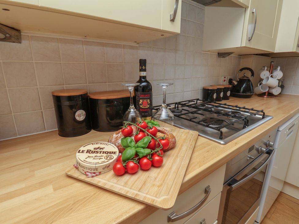 A kitchen with cooking items and ingredients at The Cosy Haven in Malton