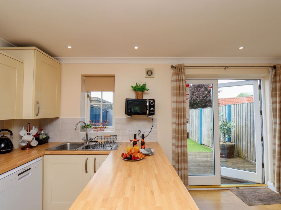 A kitchen with a counter and sink at The Cosy Haven in Malton