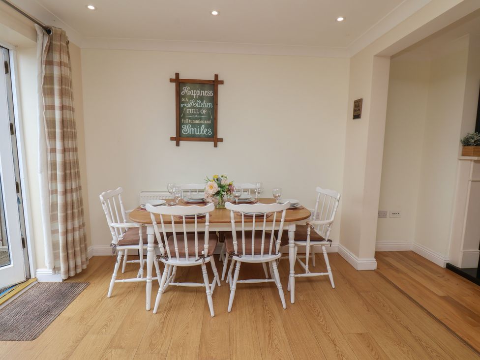 A dining room with a table and chairs at The Cosy Haven in Malton