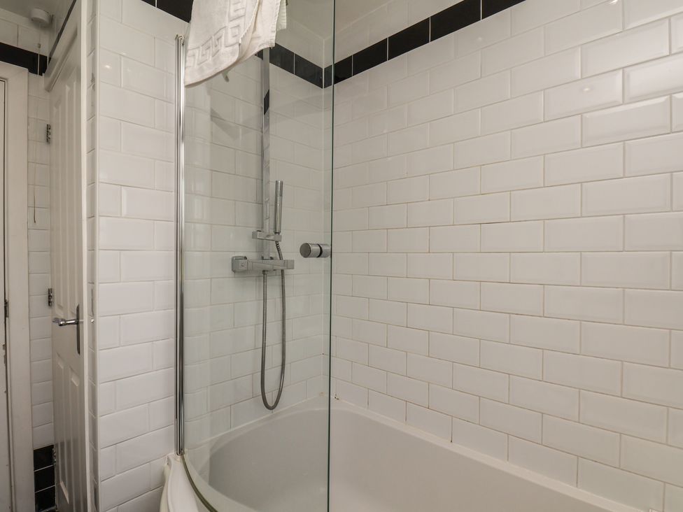 A bathroom with a bathtub and a shower at The Cosy Haven in Malton