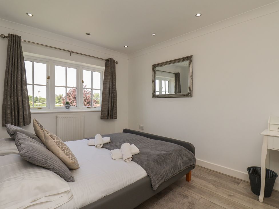 A bedroom with a bed and window at The Cosy Haven in Malton