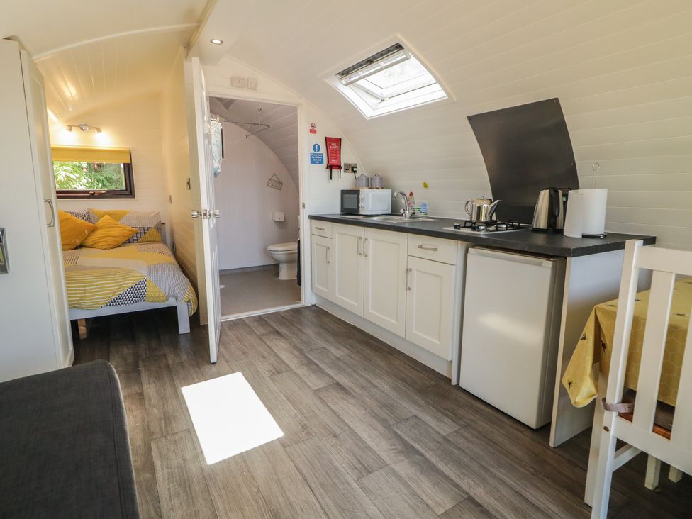 A kitchen with a bed and bathroom at Gortin Glen Glamping Pod 2 Omagh