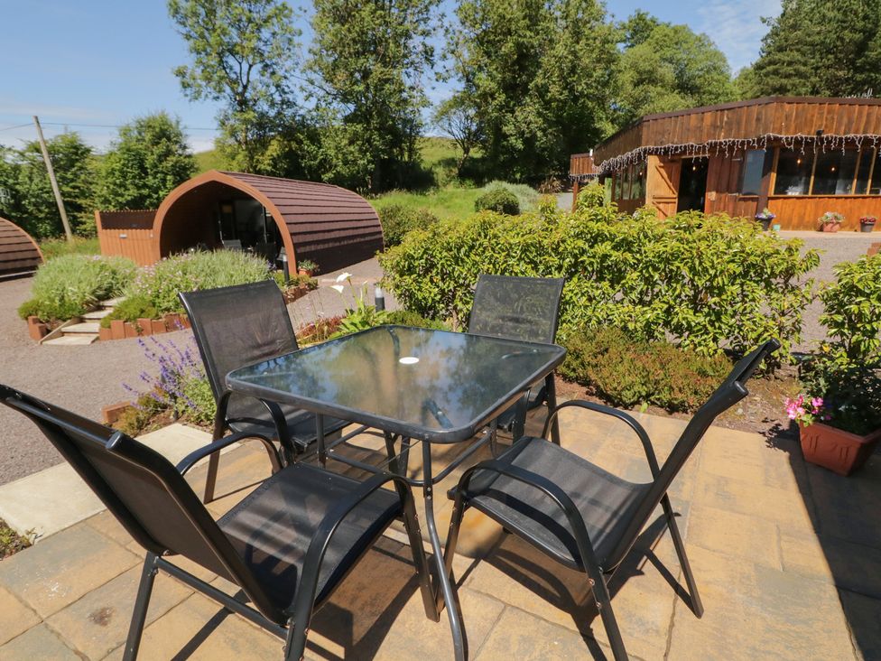 A table and chairs in an outdoor area at Gortin Glen Glamping Pod 2 Omagh