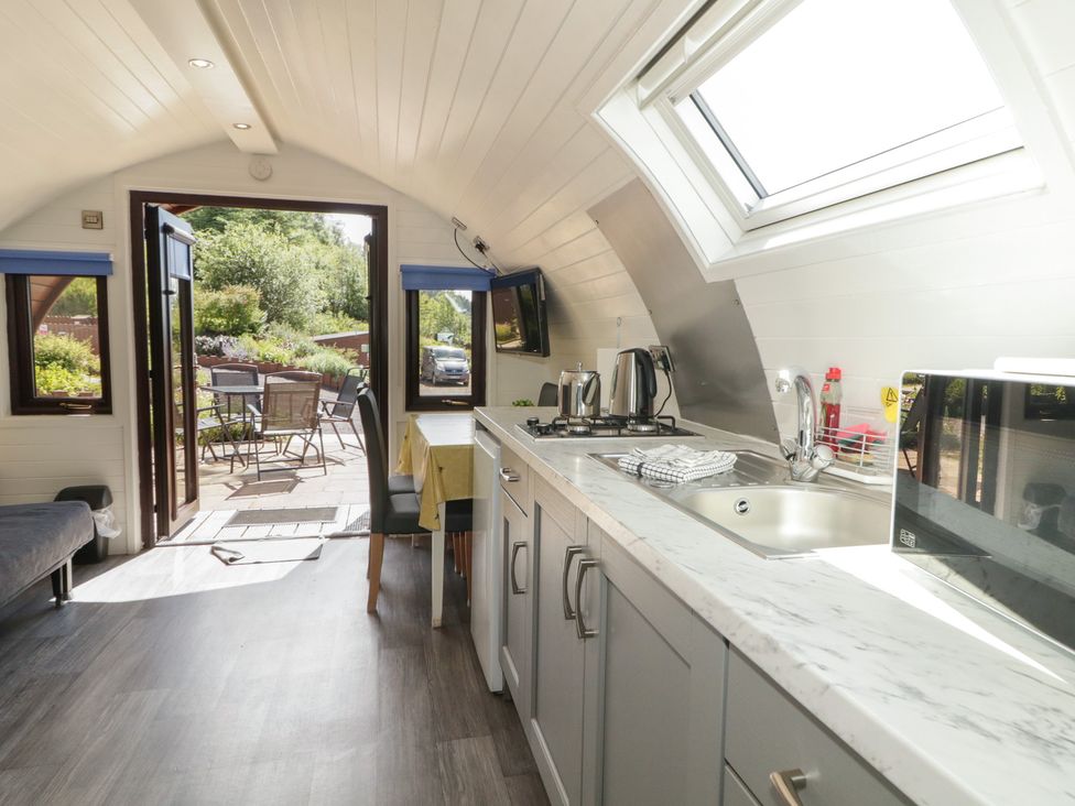 A kitchen with a sink and stove at Gortin Glen Glamping Pod 4 Omagh