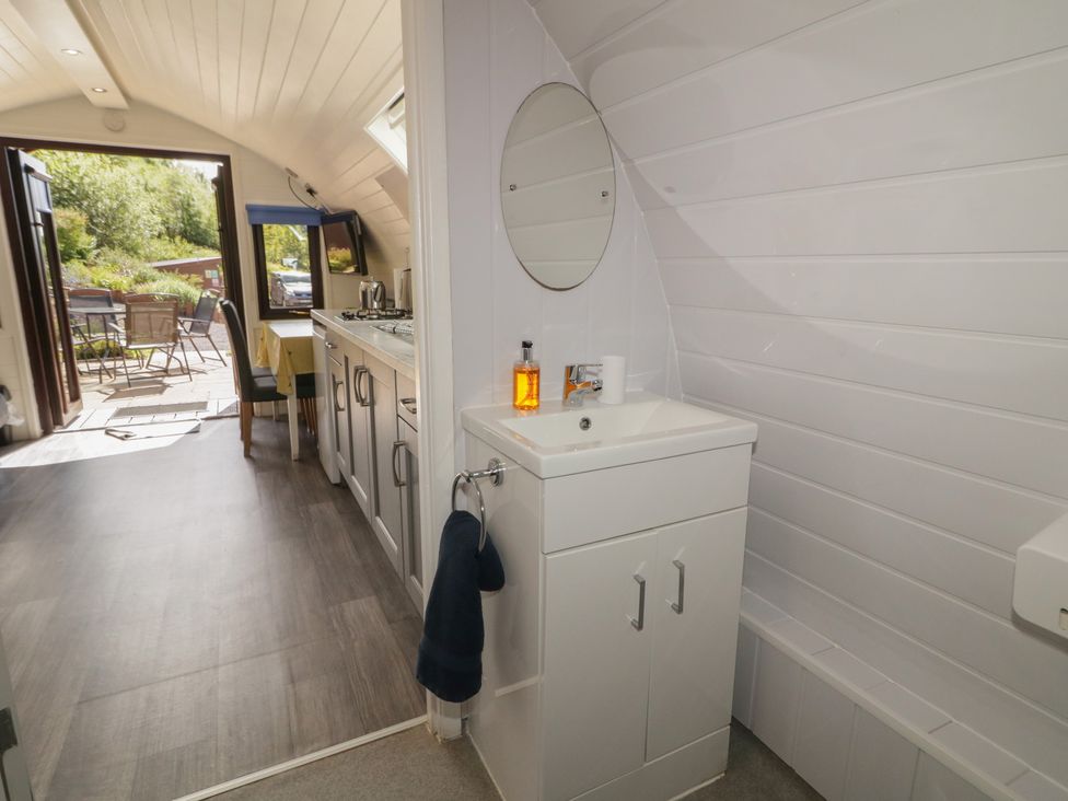A kitchen area with a sink and counter at Gortin Glen Glamping Pod 4 Omagh