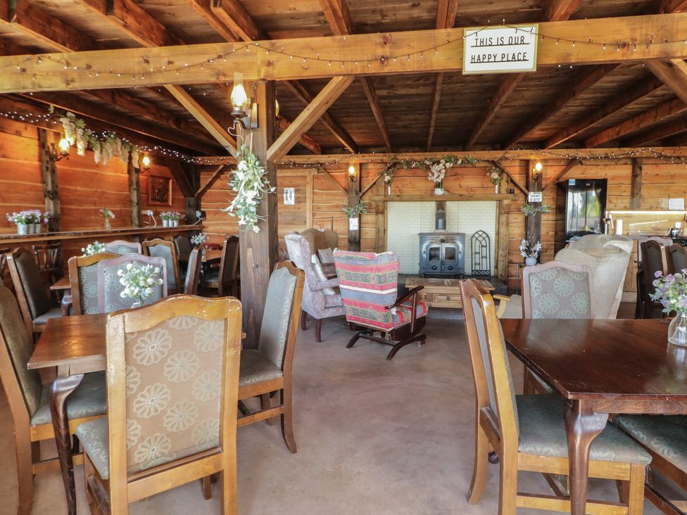 A dining room with tables and chairs at Gortin Glen Glamping Pod 4 in Omagh
