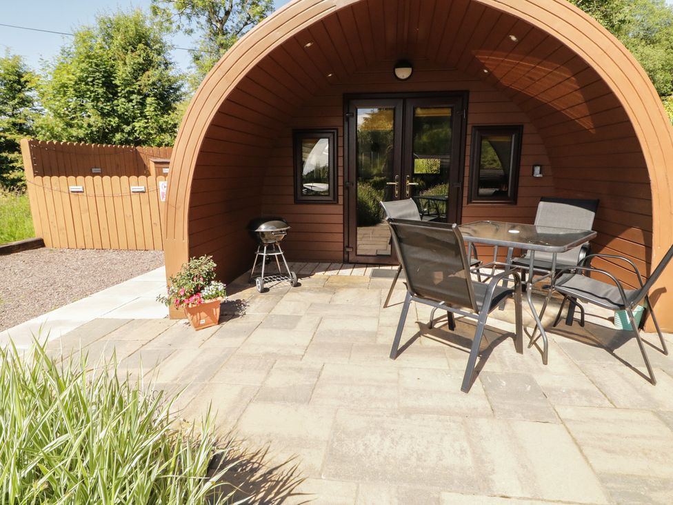 A glamping pod with a table and chairs at Gortin Glen Glamping Pod 5 Omagh