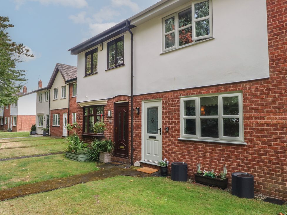 A house with a front door and windows at Coastal Cottage in Lytham St. Annes