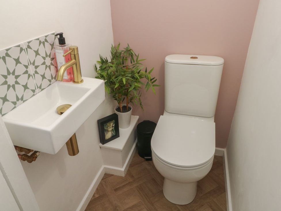 A bathroom with a toilet and sink at Coastal Cottage in Lytham St. Annes