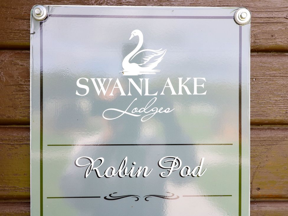 A sign for Robin Pod at Swanlake Lodges in Coalville