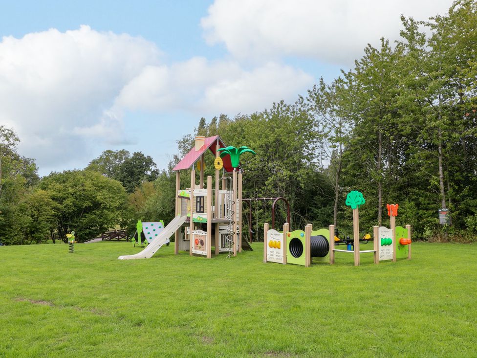 A playground with a slide and climbing structures at Robin Pod in Coalville