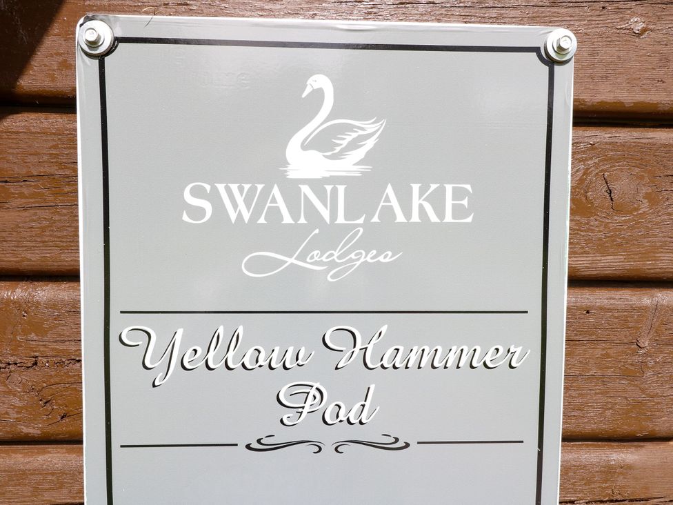 A sign for Yellow Hammer Pod at Swanlake Lodges in Swannington near Coalville