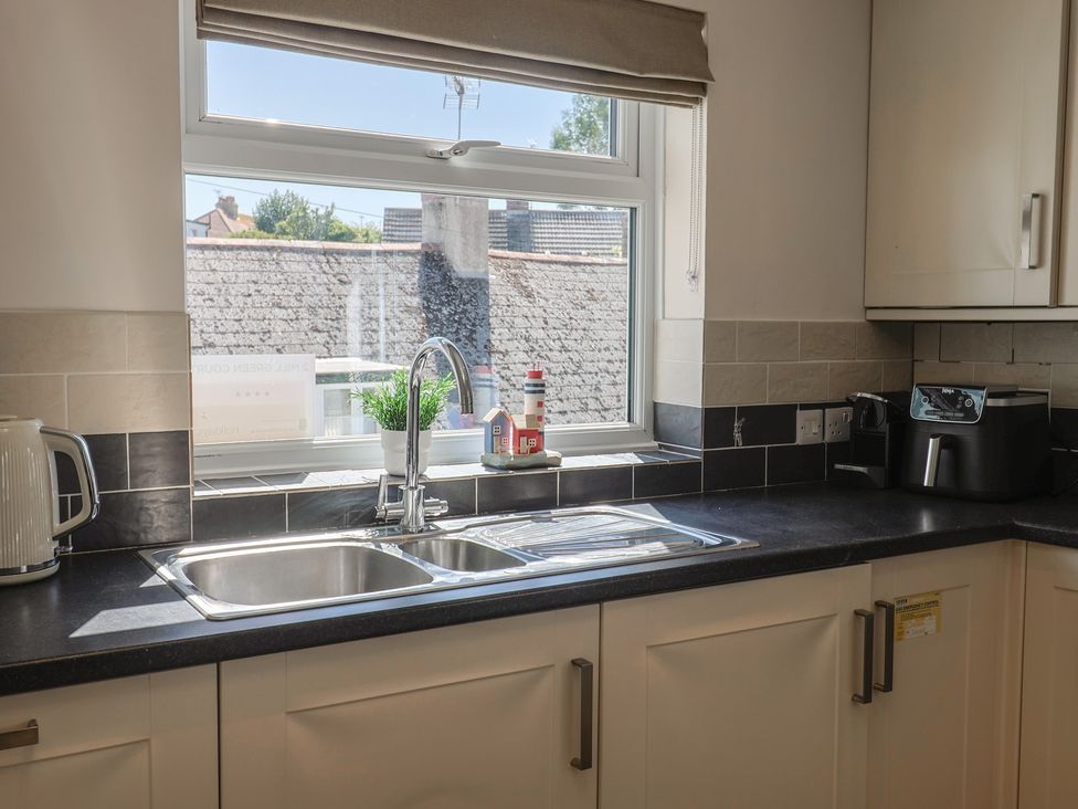 A kitchen with a sink and kettle at 2 Mill Green Court in Lyme Regis