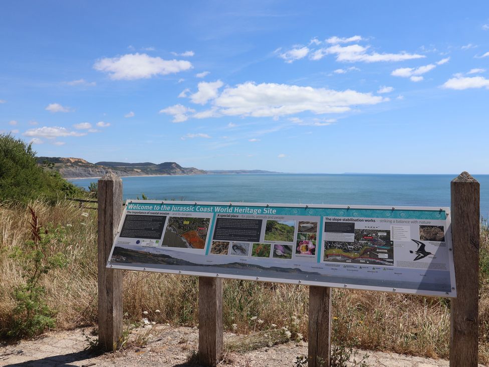A sign at the Jurassic Coast World Heritage Site overlooking the ocean at 2 Mill Green Court Lyme Regis